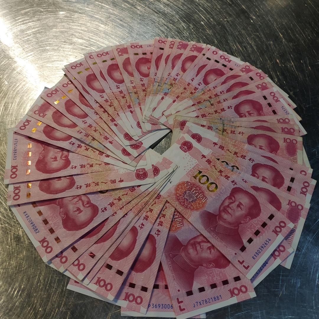向钱看奥