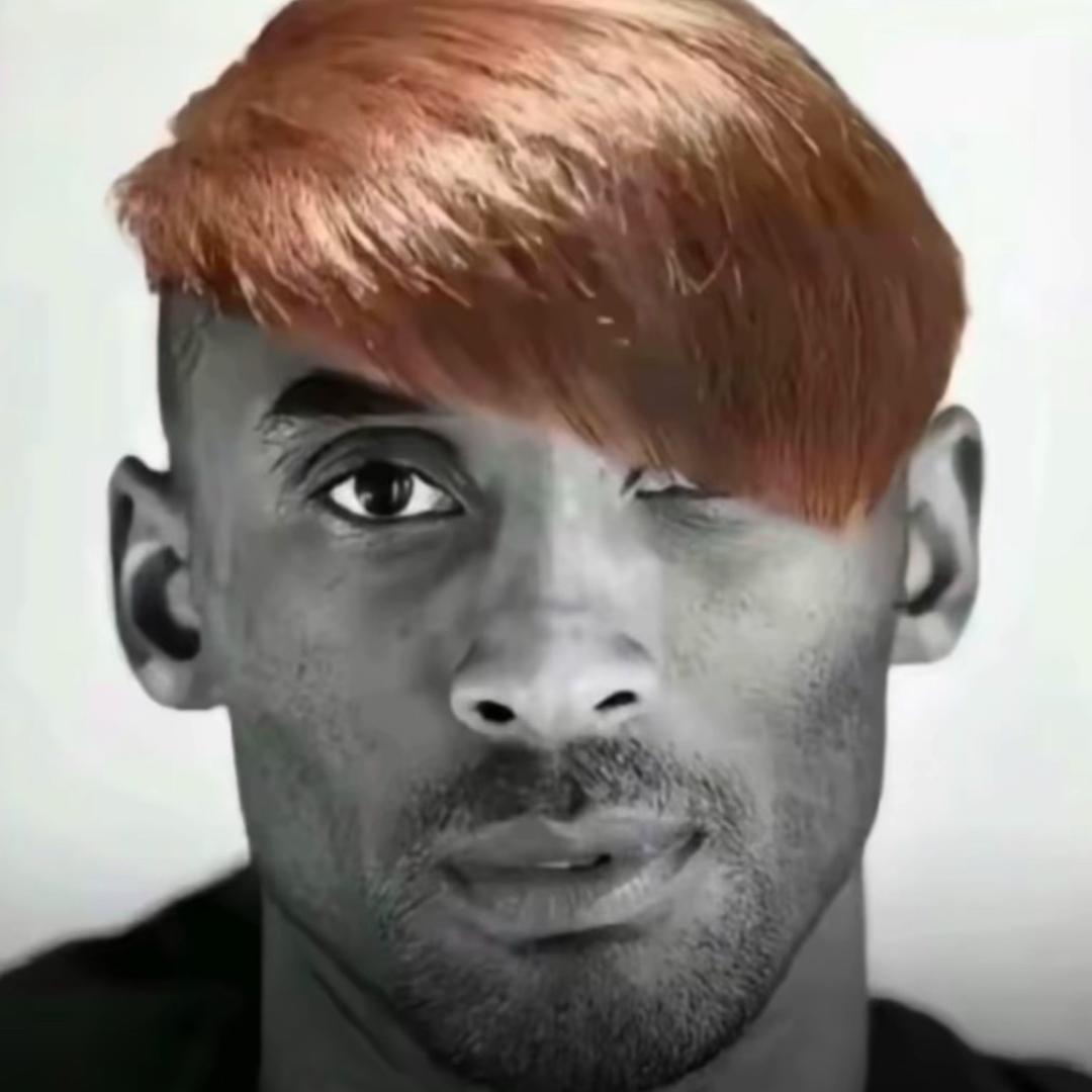 曼.
