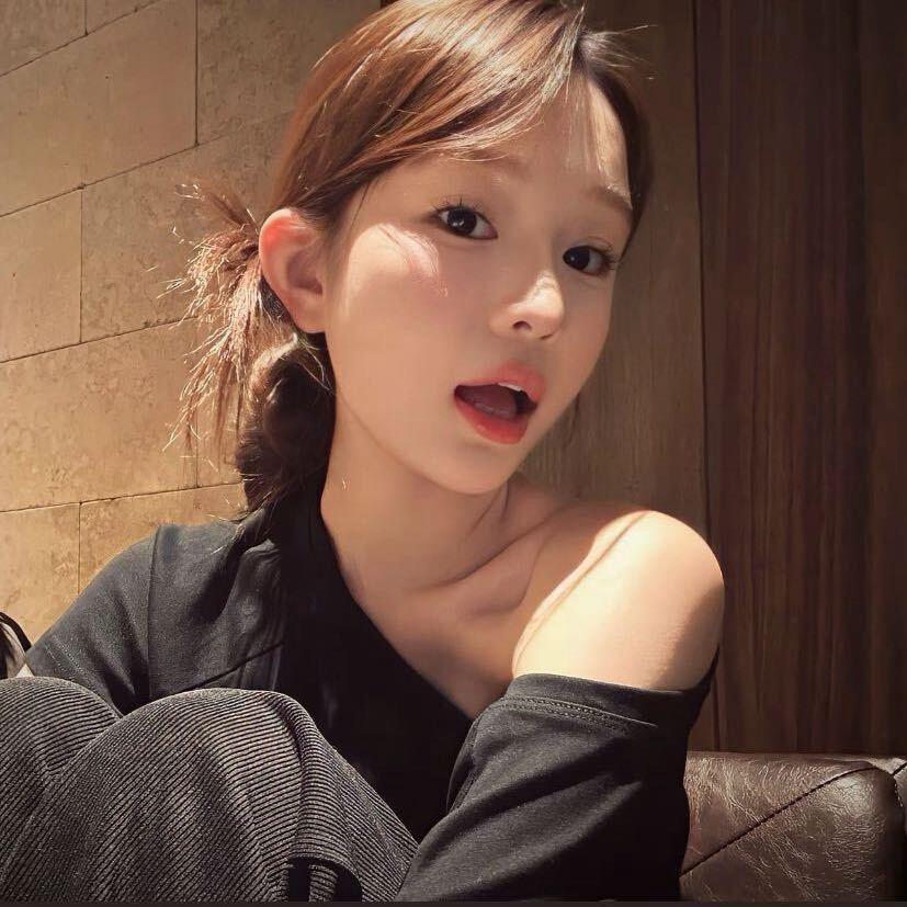 T.