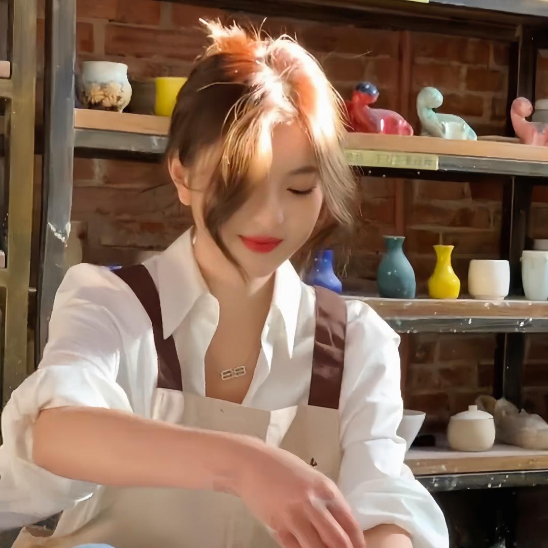美·依