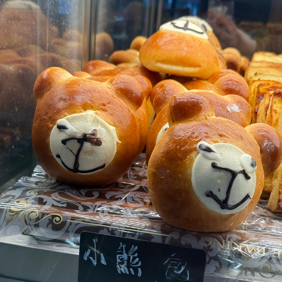 曼.