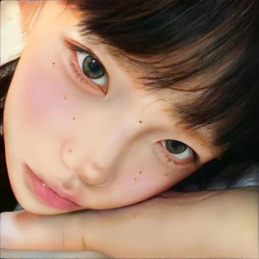 T.