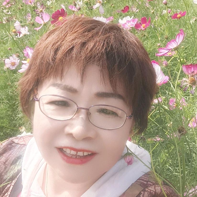 嫣然