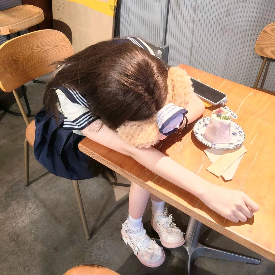 77^-