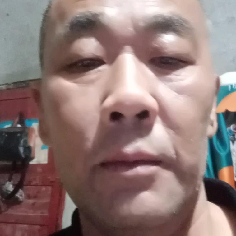 覃老十